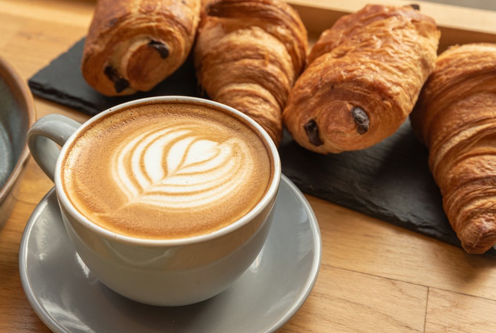 Fresh croissants with a latte