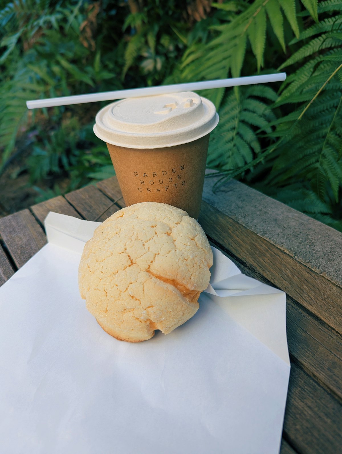 A freshly baked melon pan with coffee