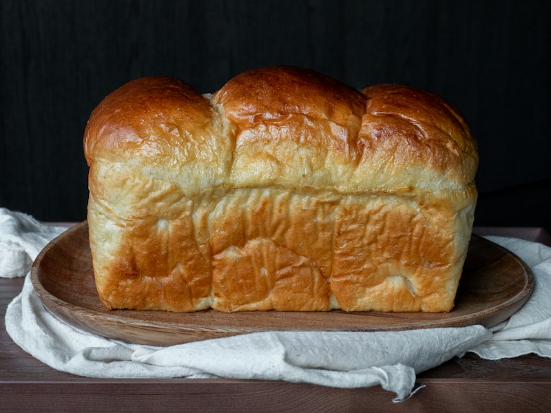 A soft, freshly baked loaf of milk bread